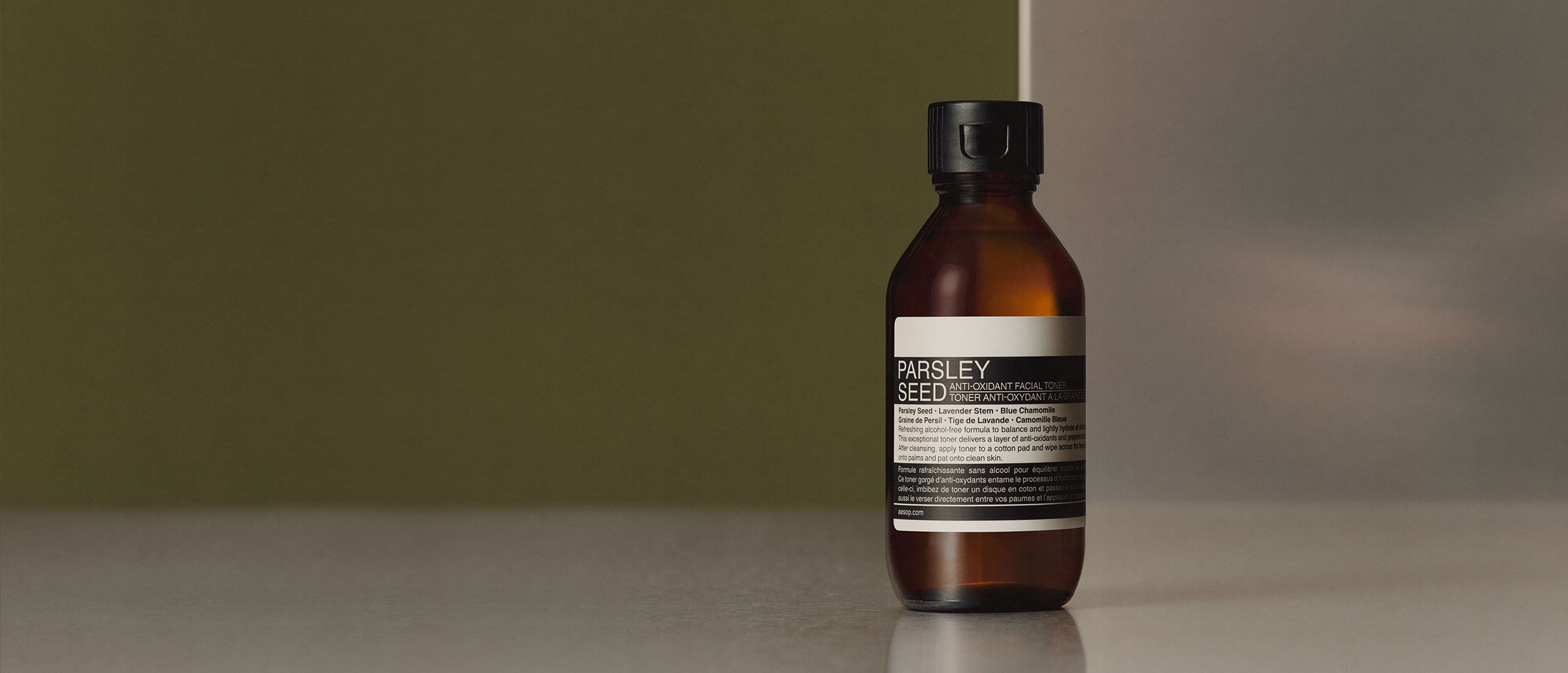 Parsley Seed Anti-Oxidant Facial Toner bottle placed on a metal surface